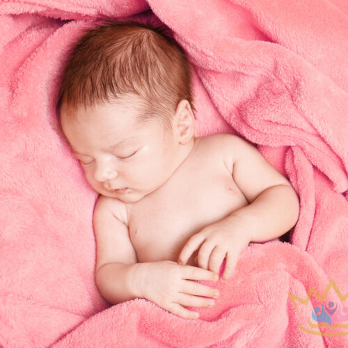 Sleeping Newborn Baby Boy On Soft Plaid At Home
