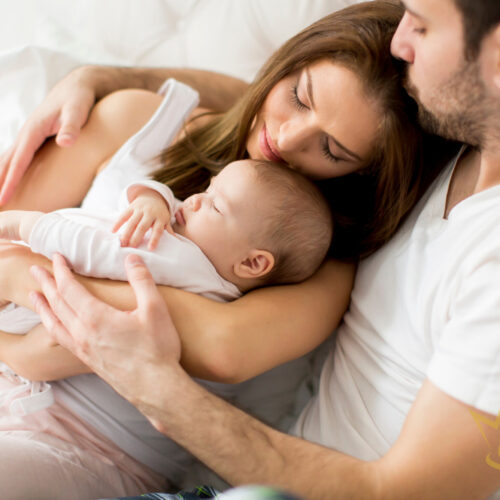 Happy Family With Newborn Baby